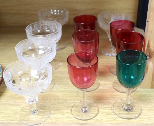 A set of five vine etched cut champagne glasses, a set of five cranberry glass bowled wine glasses and one in green (11)
